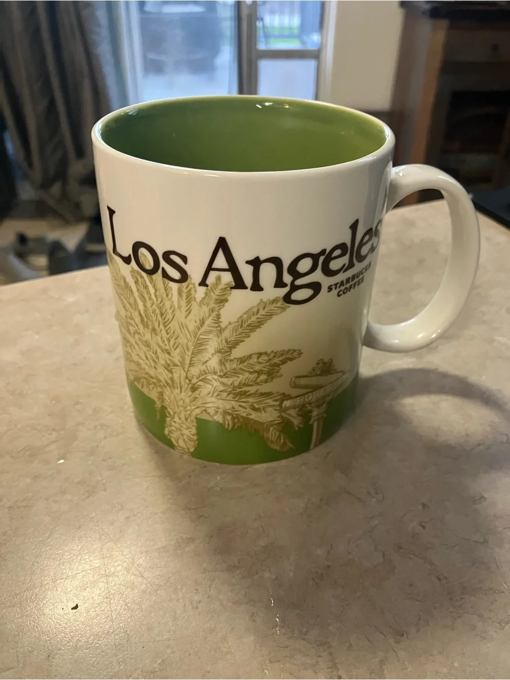 Starbucks White Mug with Green Interior and Green Alaska Lettering
